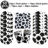 Set of cow print plates, cups, and napkins for a farm-themed party