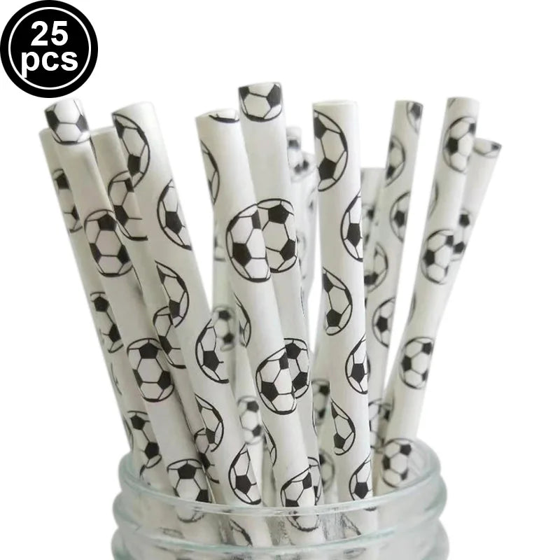 A bundle of white and black football-themed paper straws or sticks in a glass container.