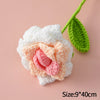 Handmade crochet tulip bouquet featuring white and pink flowers with green leaves