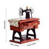 A wooden retro miniature sewing machine with a metal body and a crank, displayed on a base.