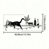 Black cat silhouette on a wooden shelf with decorative items like bottles and plants