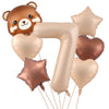 A set of foil balloons shaped like a bear and the number seven in a metallic caramel color.