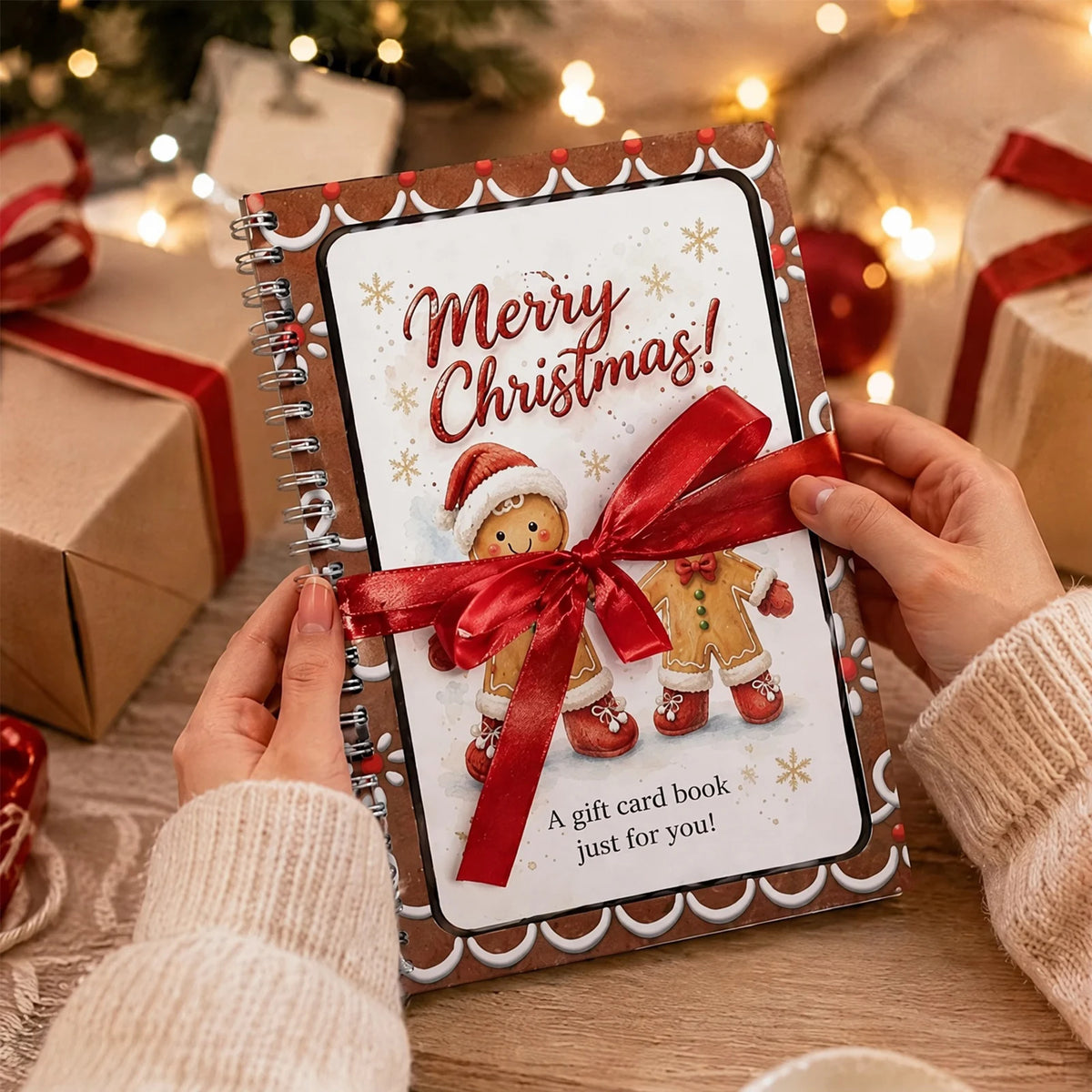 A gift card book with a festive design featuring a Santa Claus and holiday elements, set against a blurred Christmas backgrou