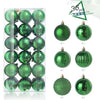 A set of 24 green and silver festive Christmas baubles for holiday tree and decor.