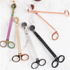 A collection of various stainless steel candle wick trimmer scissors in pink, gold, and black.