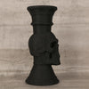 A black skull-shaped decorative vase with a ribbed neck and flared base.
