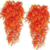 Two strands of artificial black vine hanging plants with bright orange and red leaves