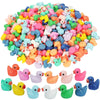 A large pile of mini resin colorful duck decorations in various bright colors.