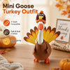 A felt turkey costume shaped like a goose with a large orange beak and yellow feathers, displayed on a wooden surface.