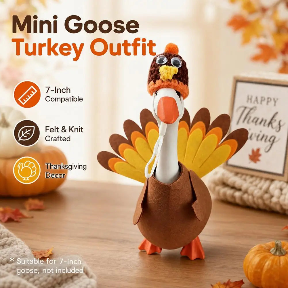 A felt turkey costume shaped like a goose with a large orange beak and yellow feathers, displayed on a wooden surface.