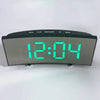 An LED mirror alarm clock with a large curved display showing 12:04 and control buttons.