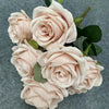 A bouquet of nine realistic pale pink silk roses arranged on a dark gray background.