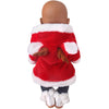 A brown-skinned doll wearing a red and white faux fur Christmas outfit with black pants and white fluffy boots.