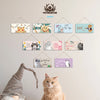A collection of wooden cat wall plaques featuring cats and related phrases like I love you and my life.