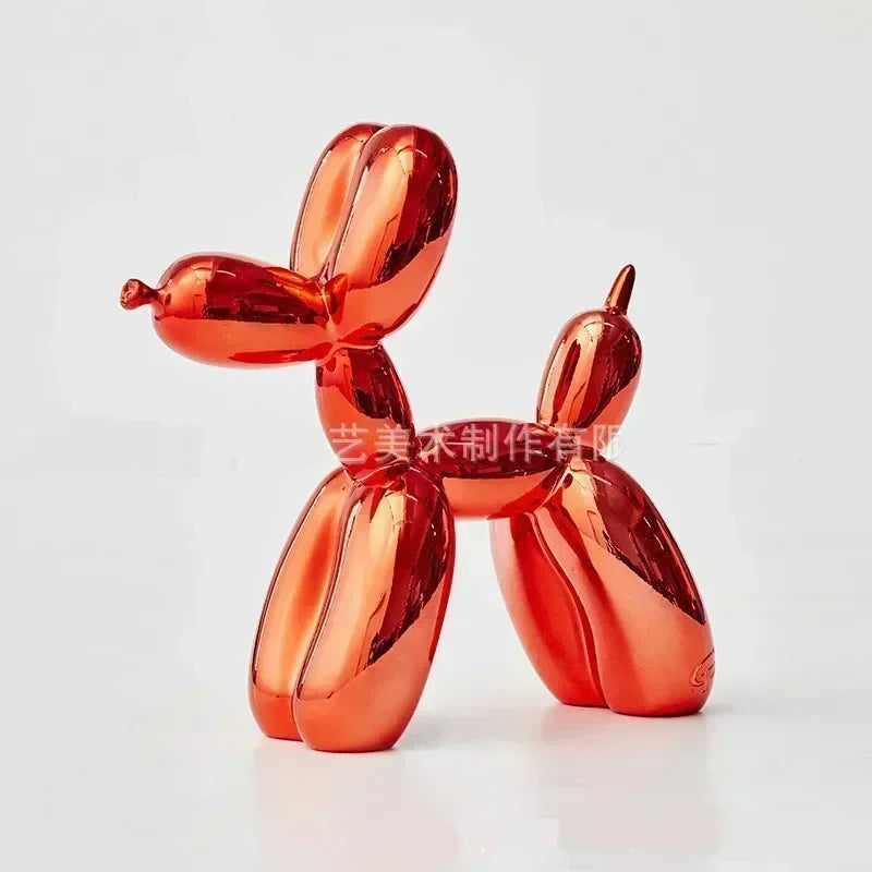 A glossy orange resin sculpture shaped like a stylized dog or animal, used as whimsical decor.