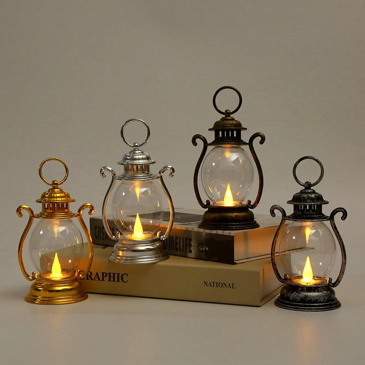 A collection of vintage battery-powered desk lamps featuring glass globes and brass accents on a wooden surface.