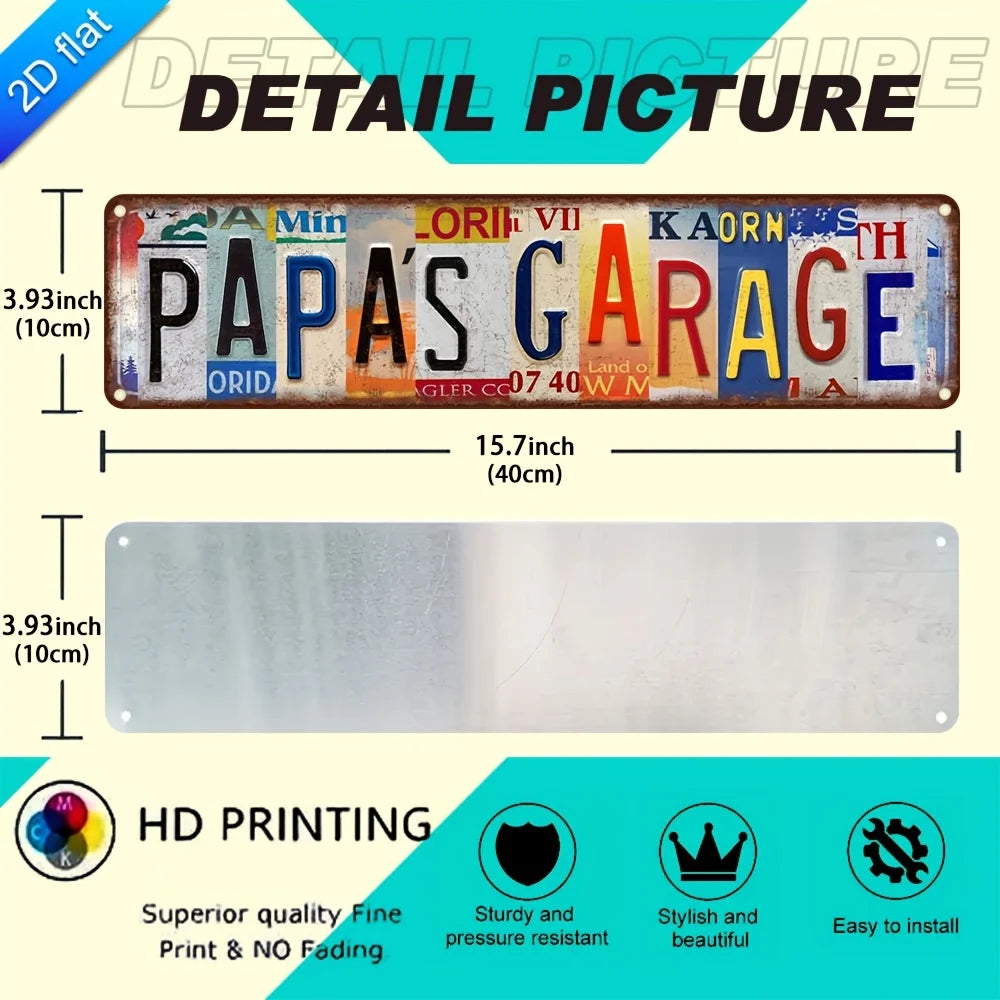 Detail picture of a vintage aluminum metal wall art sign with the text Papa's Garage