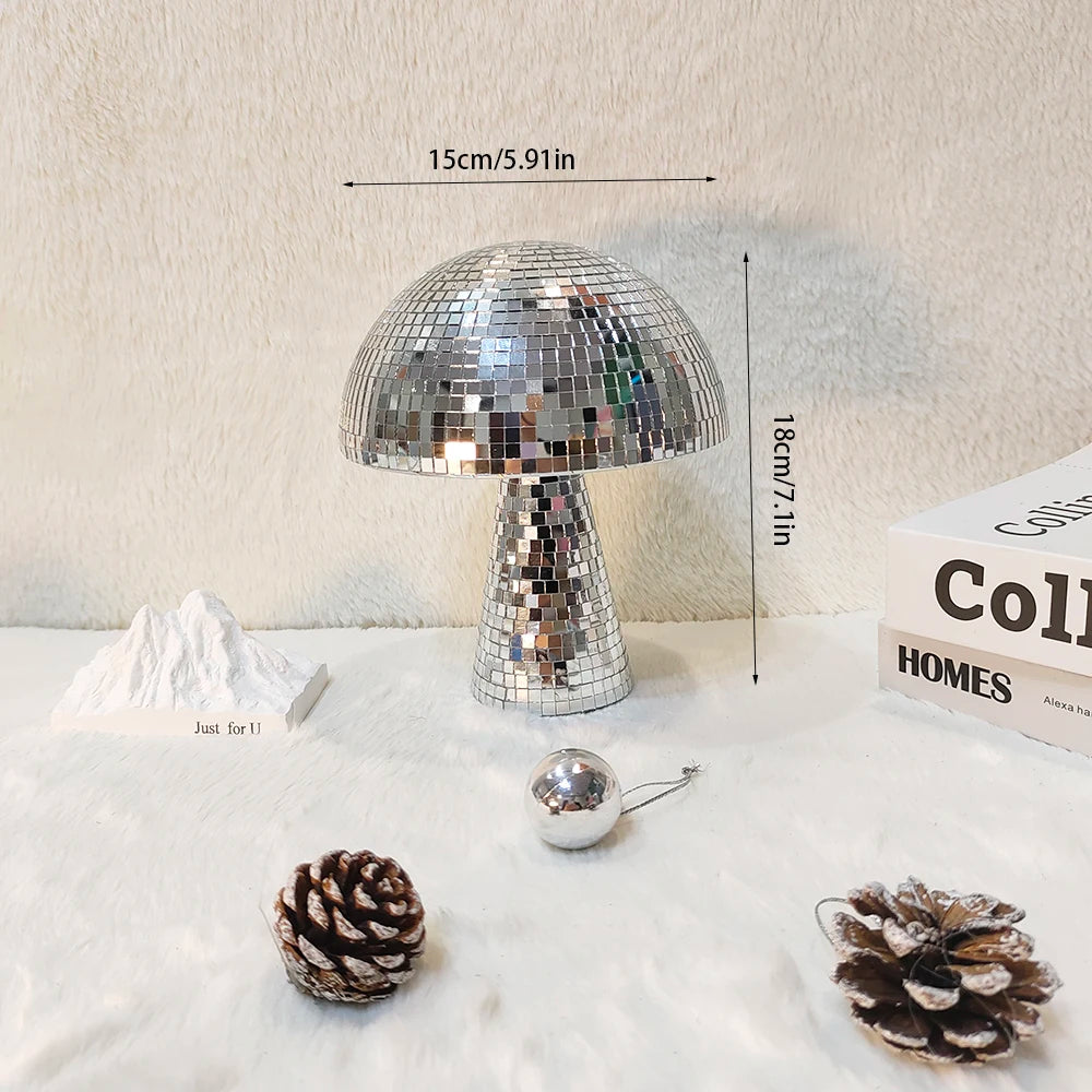 Silver mushroom-shaped disco ball decoration with a textured base and a conical dome.