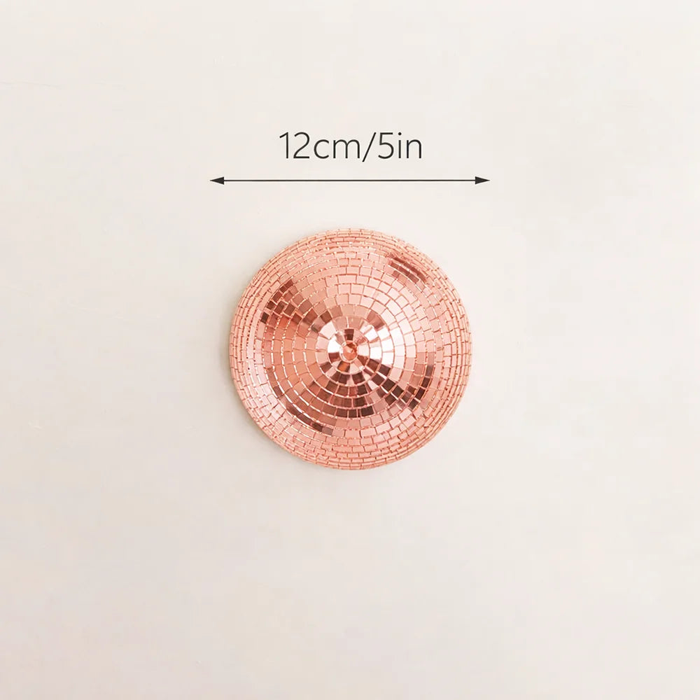A round, rose gold mosaic disco ball with a 12cm diameter, shown against a light background.
