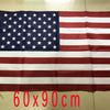 A rectangular American flag displayed flat on a surface, featuring the stars and stripes pattern.
