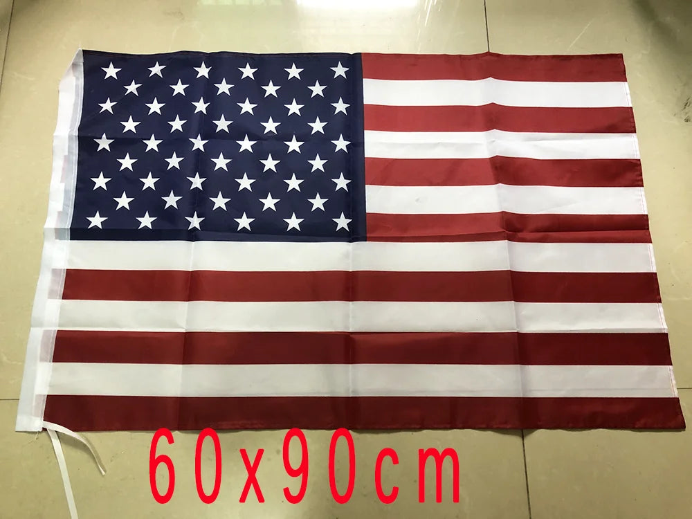 A rectangular American flag displayed flat on a surface, measuring 60x90 cm.