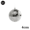 A silver, spherical mirror ball with a hanging hook.