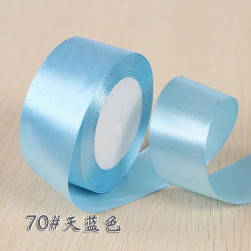 Roll of light blue silk satin ribbon for gift wrapping and craft projects