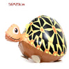 A brown cartoon farm animal foil balloon shaped like a turtle with a black and yellow patterned skin.