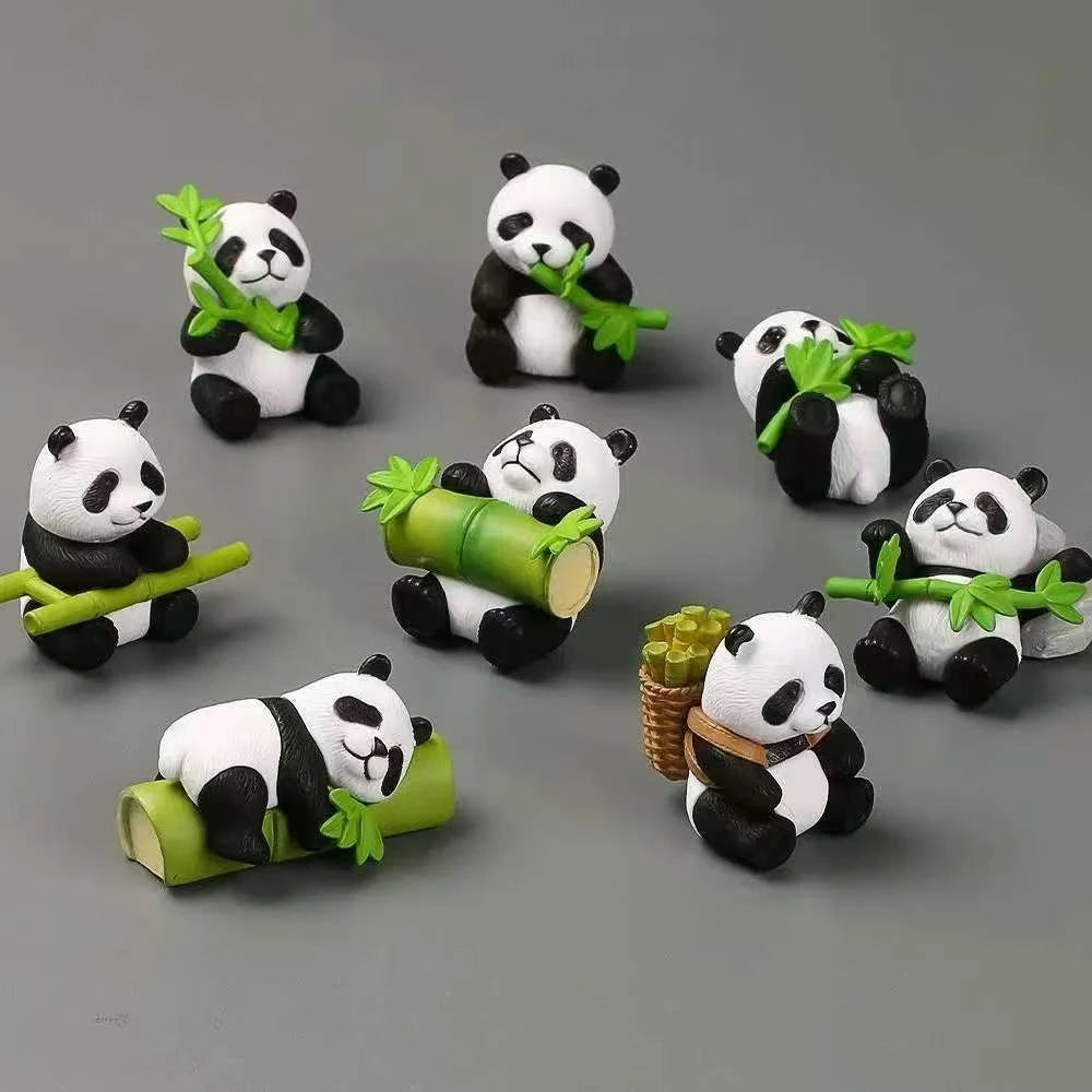 A set of mini resin panda bonsai figurines with green leaves and bamboo stalks.