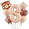 A set of foil balloons featuring a cute bear, the number eight, and various star-shaped balloons in gold and bronze colors.