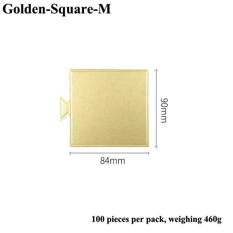 A rectangular metallic gold dessert cake board measuring 84mm by 90mm.
