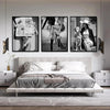 A set of three black and white art prints featuring women in high heels and modern clothing displayed on a wall.