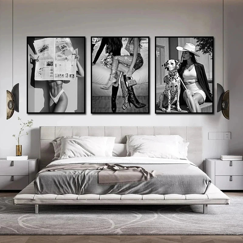 A set of three black and white art prints featuring women in high heels and modern clothing displayed on a wall.