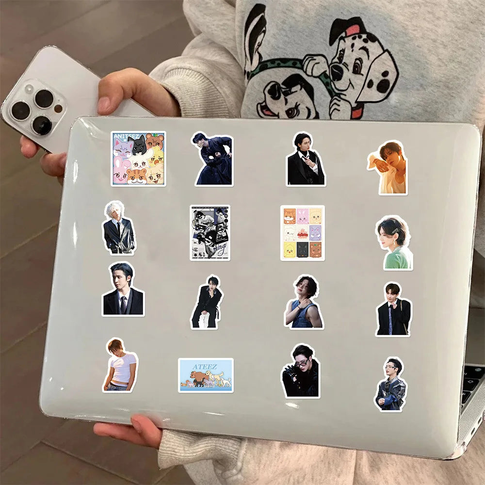 A laptop displaying various K-Pop idol stickers for luggage and accessories