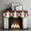 Festive Christmas fireplace scarf featuring a pine and berry print displayed above a black fireplace.