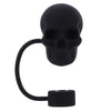 A black silicone straw cover shaped like a skull on a metal loop.