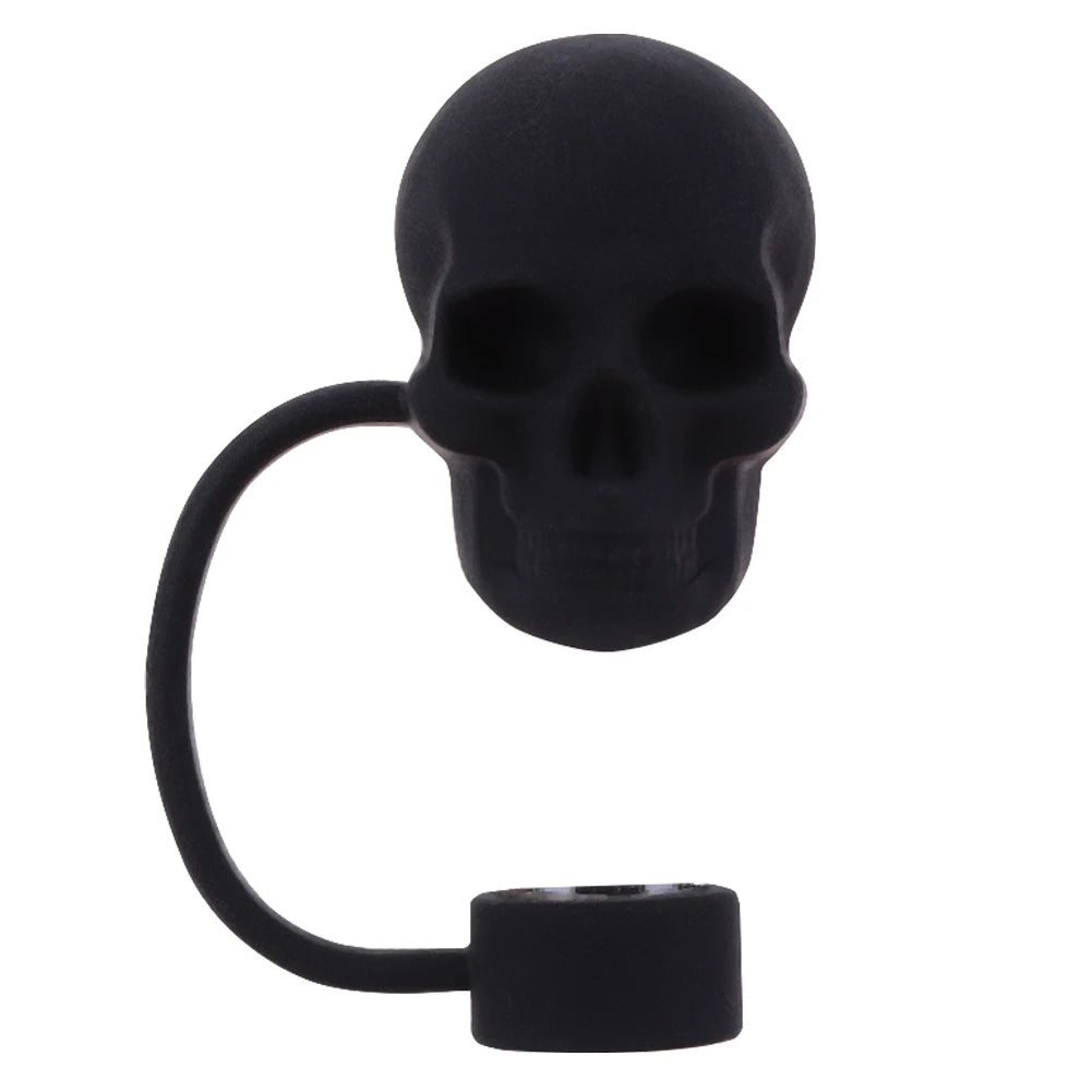 A black silicone straw cover shaped like a skull on a metal loop.