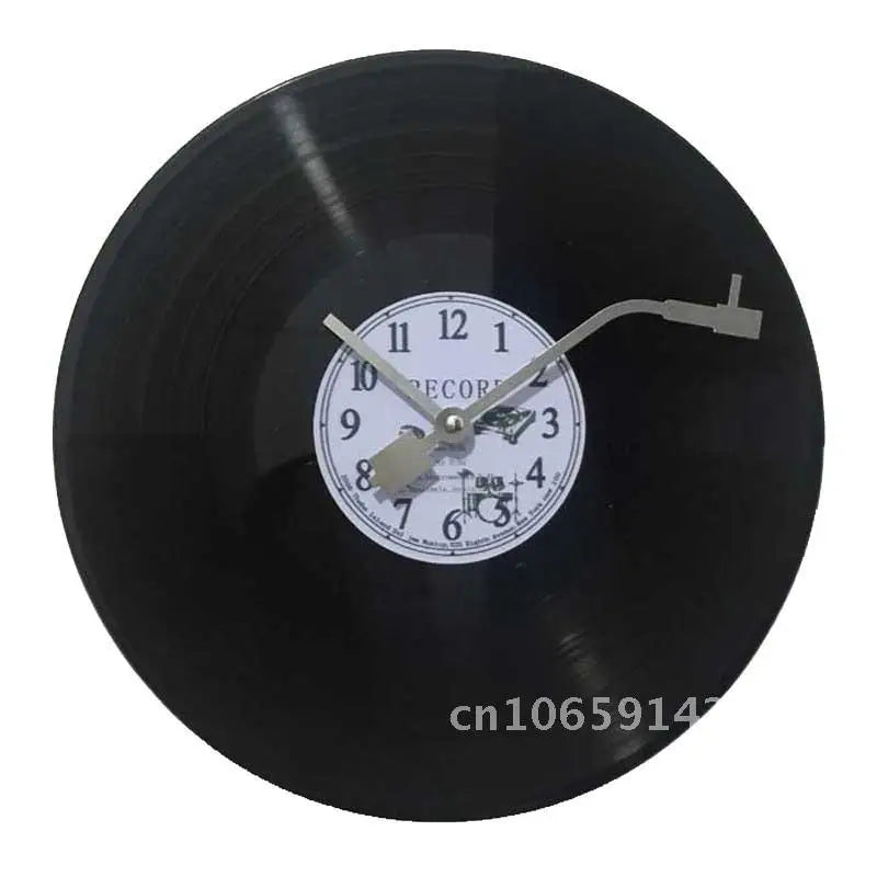 A black decorative vinyl record wall clock showing the time and a record graphic.