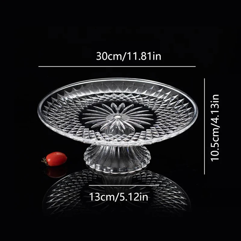 Clear acrylic serving plate with a decorative pattern shown against a black background.