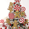 Christmas tree toppers featuring gingerbread men and peppermint swirl ornaments