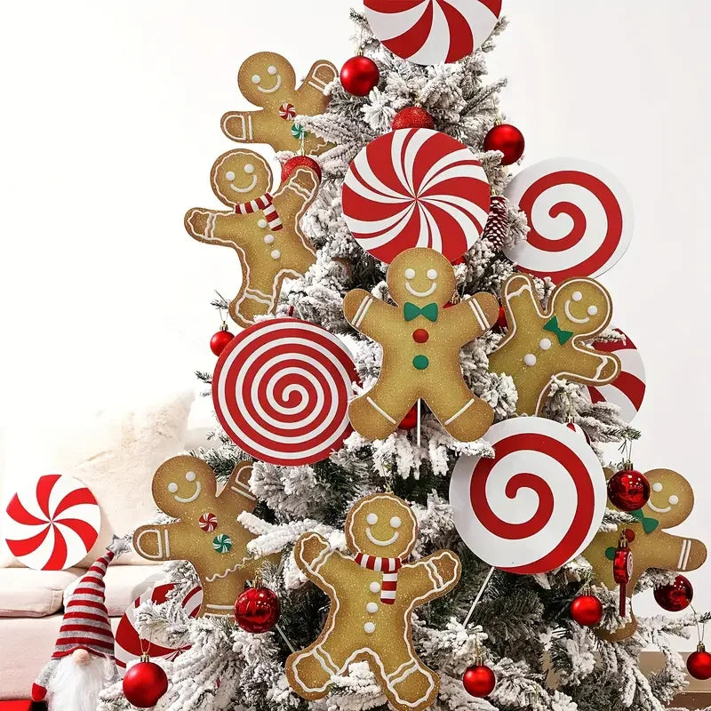 Christmas tree toppers featuring gingerbread men and peppermint swirl ornaments
