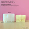 A white silicone mold and a finished yellow candle are displayed on a wooden surface.