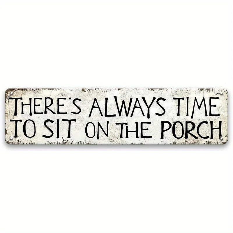A weathered white metal sign with black text that reads There's always time to sit on the porch