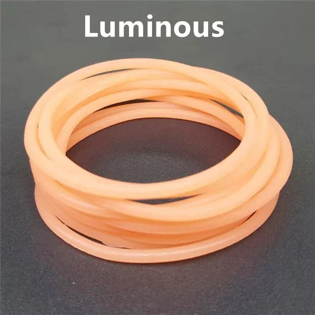 A set of ten luminous orange silicone bracelets arranged in a circle.