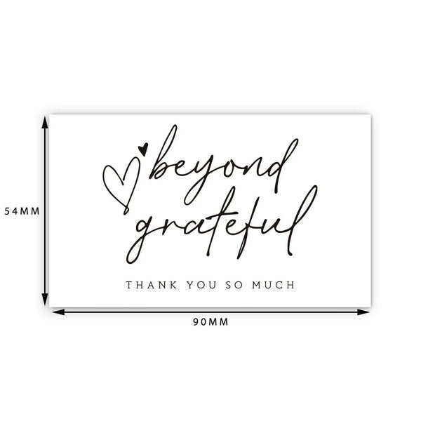 A white thank you card with handwritten text that says beyond grateful and thank you so much