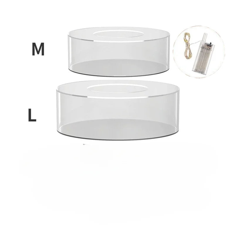 Clear acrylic cake stand display box shown in medium and large sizes with an inset of LED lights