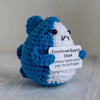 Handmade plush knitting doll shaped like a shark with blue and white coloring, offering emotional support.