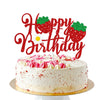 A cake decorated with red strawberry toppers spelling 'Happy Birthday' on a white frosting cake.