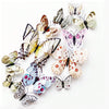 A collection of twelve colorful and patterned butterfly decorations for wall decor.