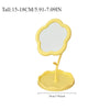 Yellow floral decorative desktop mirror with a scalloped frame and stand.